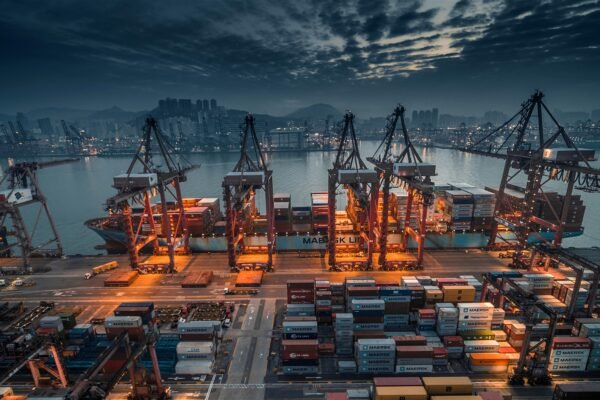 Aerial view of a busy container terminal with gantry cranes, representative image for Gwadar Port's place in regional trade connectivity