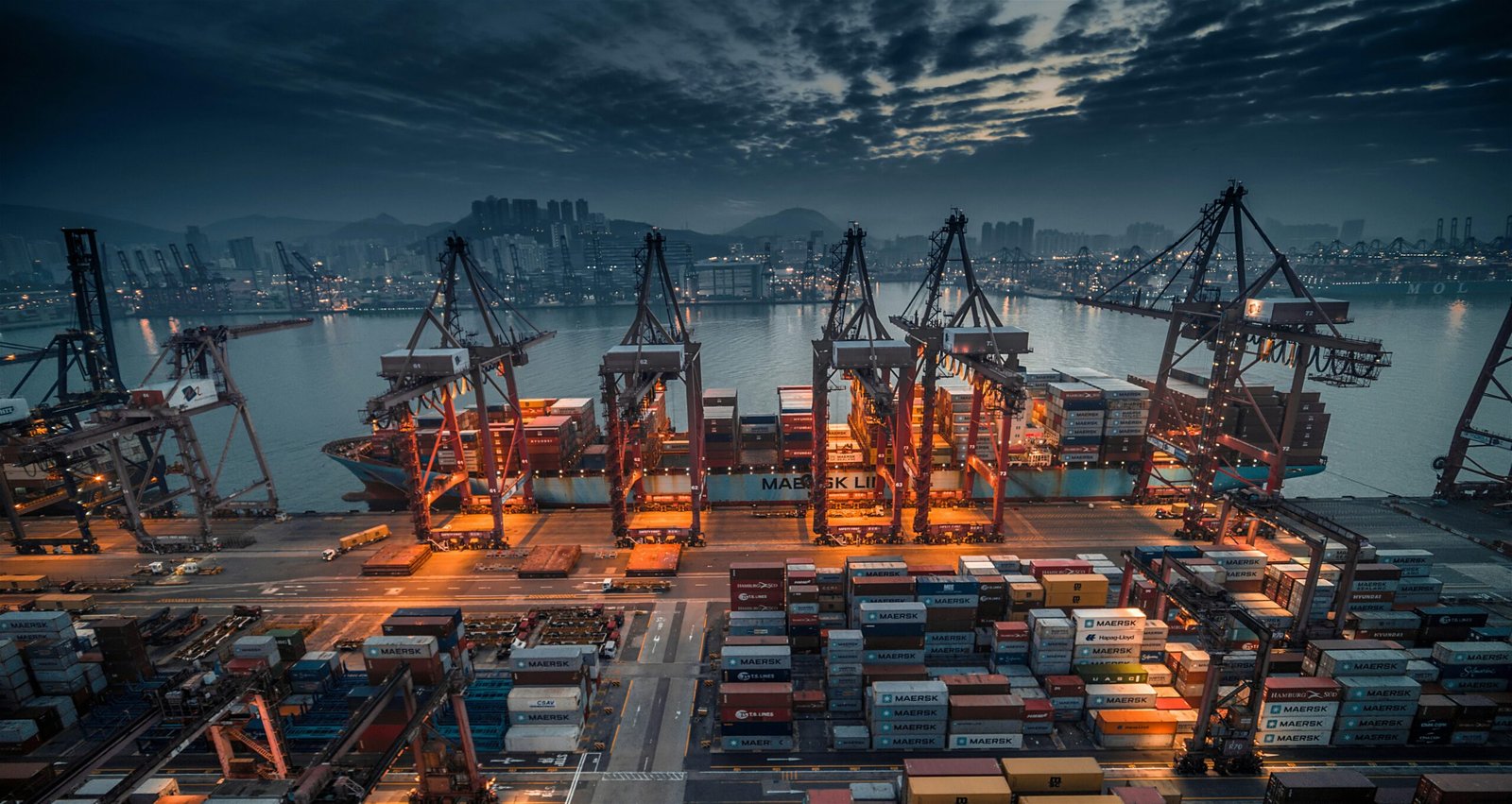 Aerial view of a busy container terminal with gantry cranes, representative image for Gwadar Port's place in regional trade connectivity
