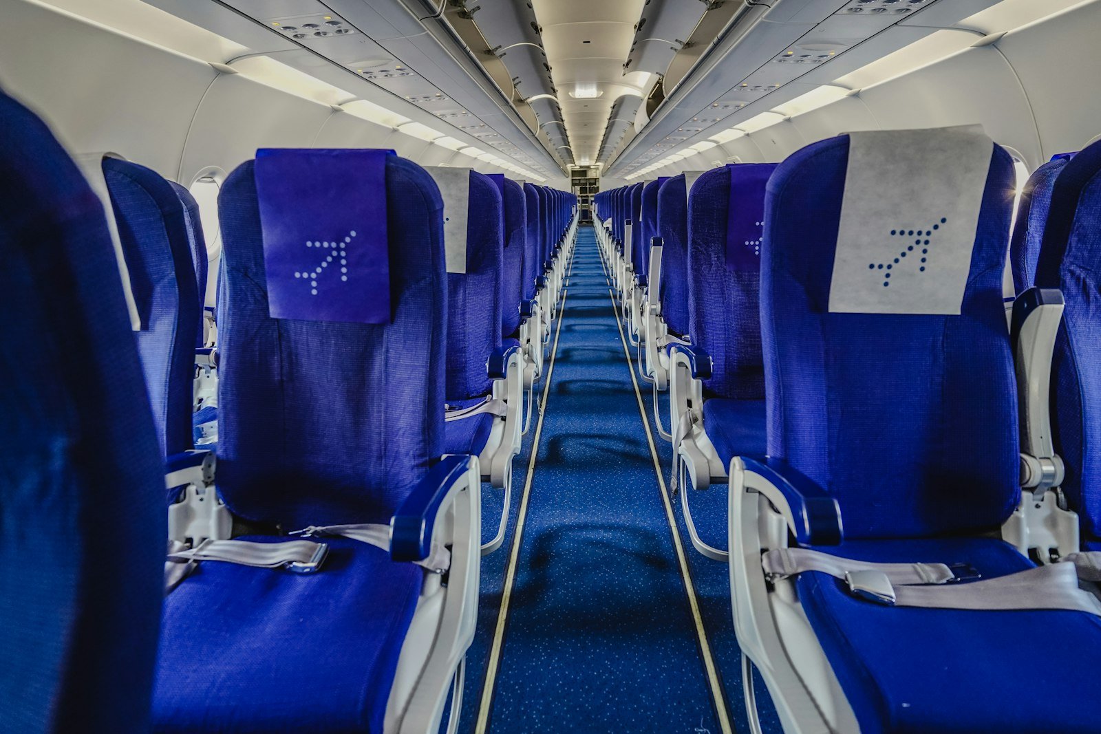 Rows of airplane passenger seats, representing cheaper Gwadar flight tickets
