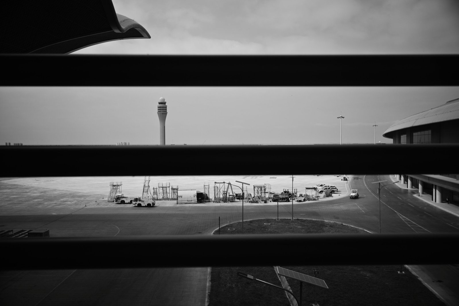 Airport control tower seen through window blinds, representative image for the New Gwadar International Airport discussed in the CPEC review