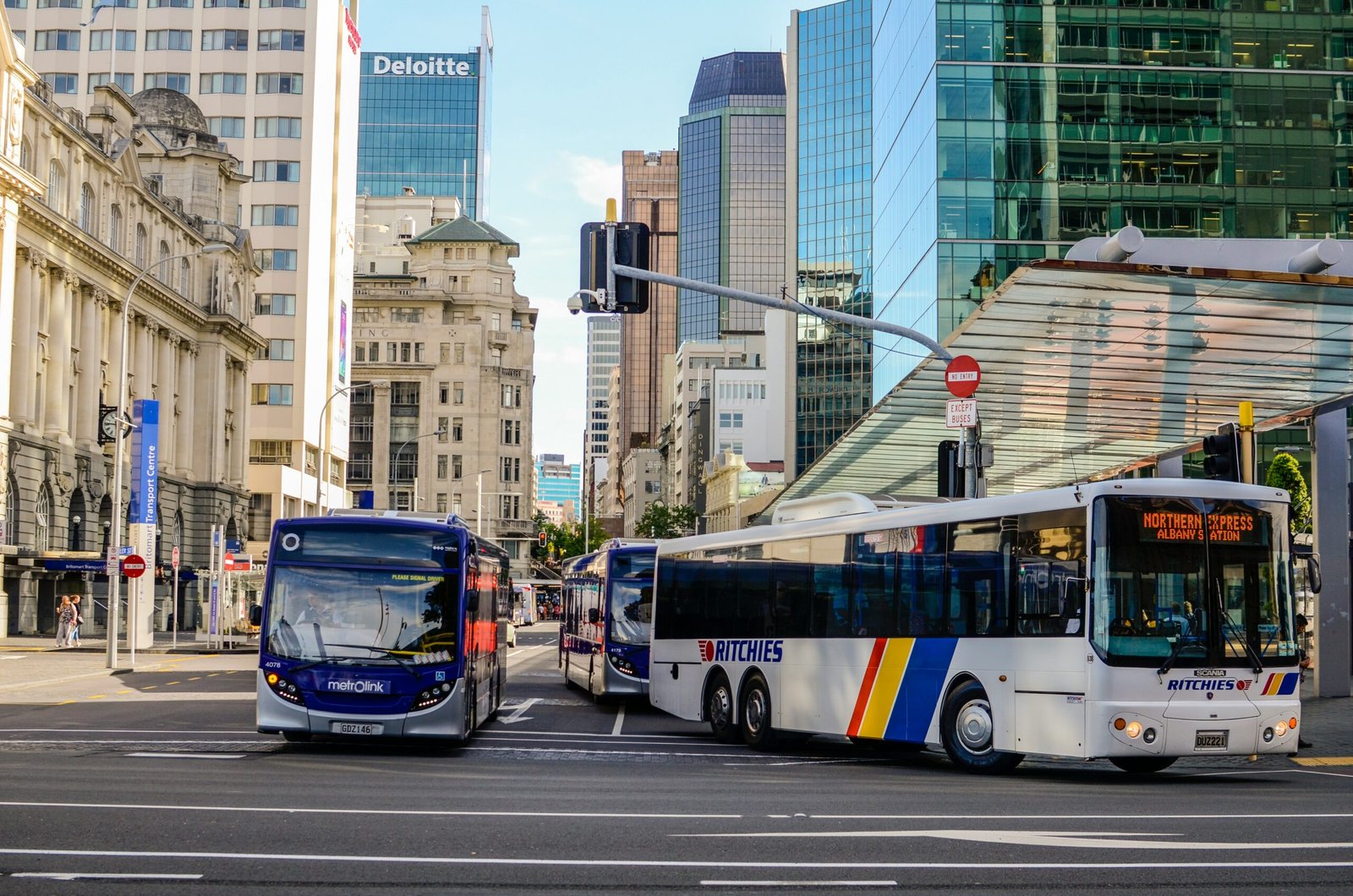 Blue and white city bus on a daytime road, representative image for feeder-route electric buses planned under Balochistan's public transport expansion