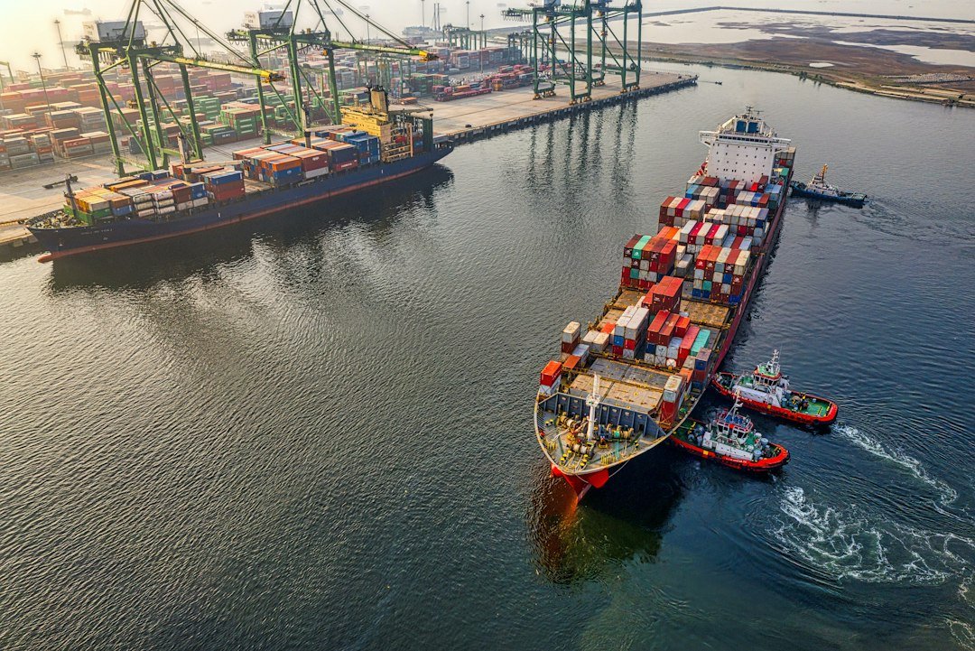 Cargo ship at a container port, illustrating Gwadar Port's rising shipping volumes under CPEC