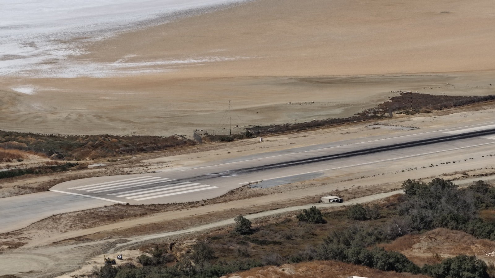 Aerial view of a desert airstrip and runway, evoking Balochistan's remote geography