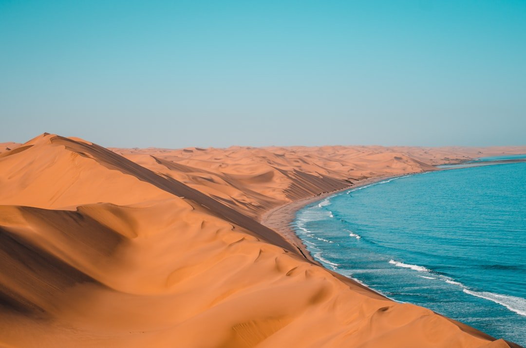 A desert coastline meeting the sea, representative image for the Arabian Sea coast shared by Gwadar and Chabahar