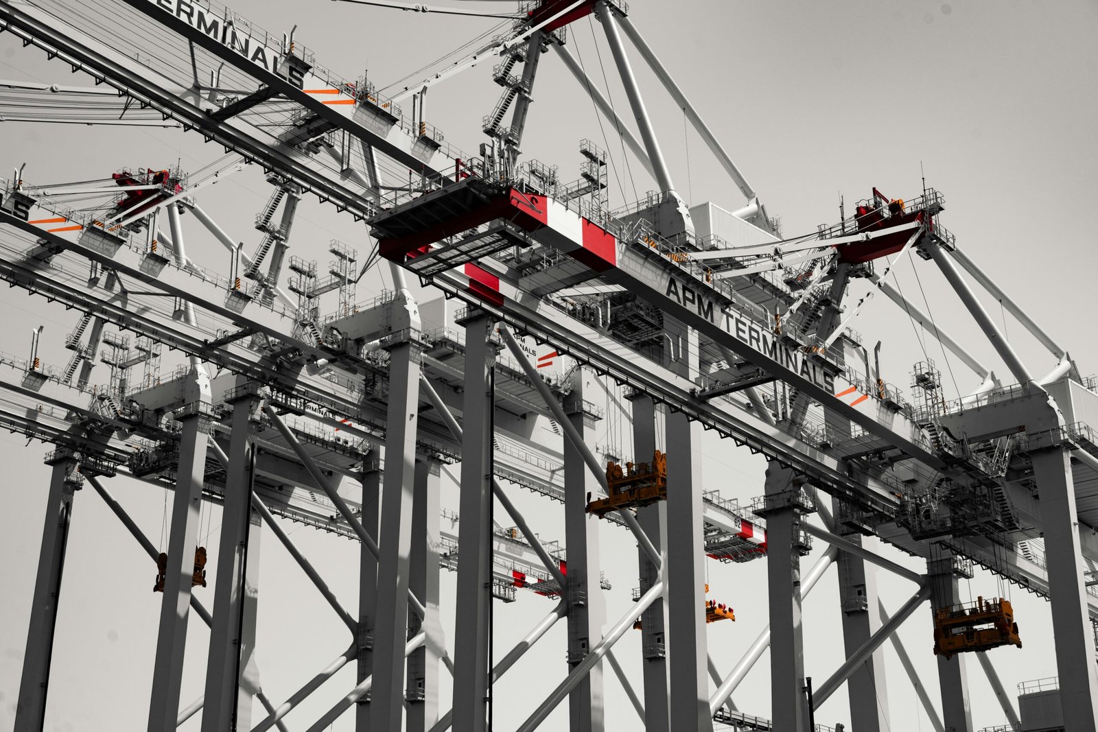 Large industrial port cranes against a clear sky, representing the ongoing Phase II expansion of the Gwadar Free Zone