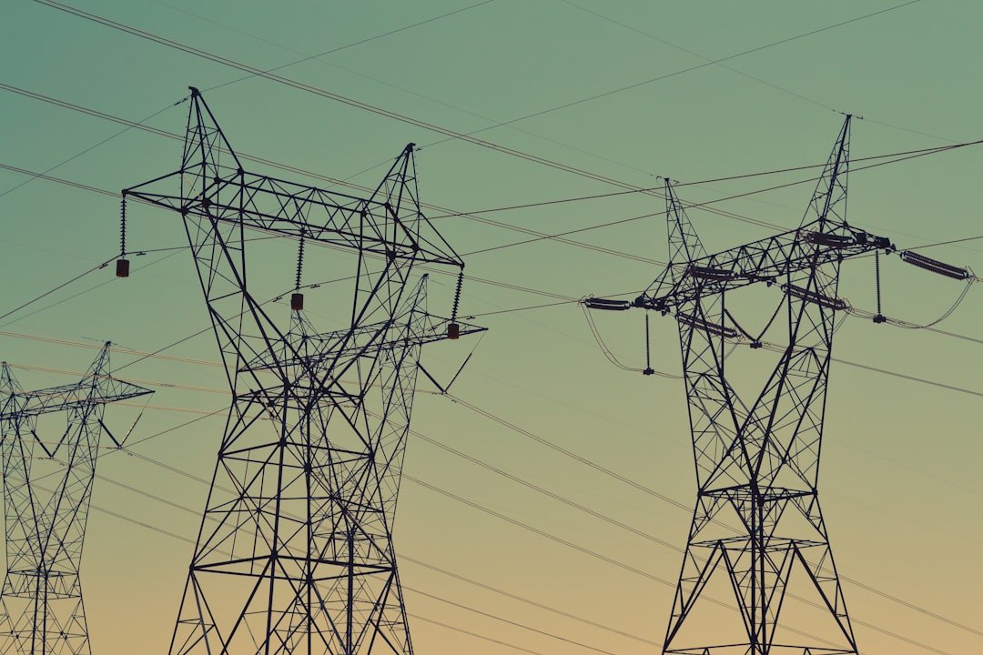 A dense grid of overhead power lines against the sky, representative image for chronic electricity shortfalls in Gwadar