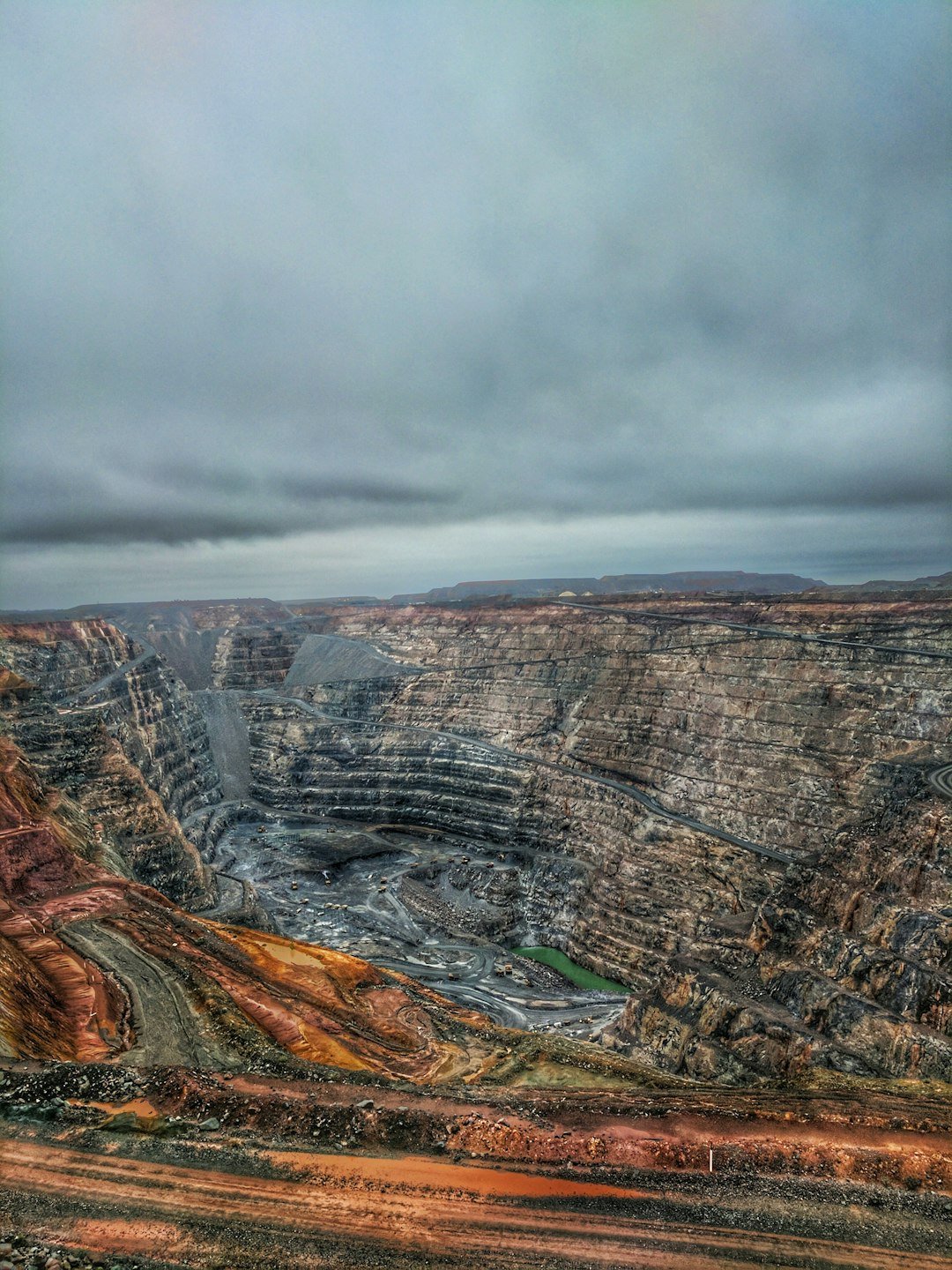 A large open-pit mine in a remote, arid landscape, representative image for the scale of the Reko Diq copper-gold deposit in Chagai district, Balochistan