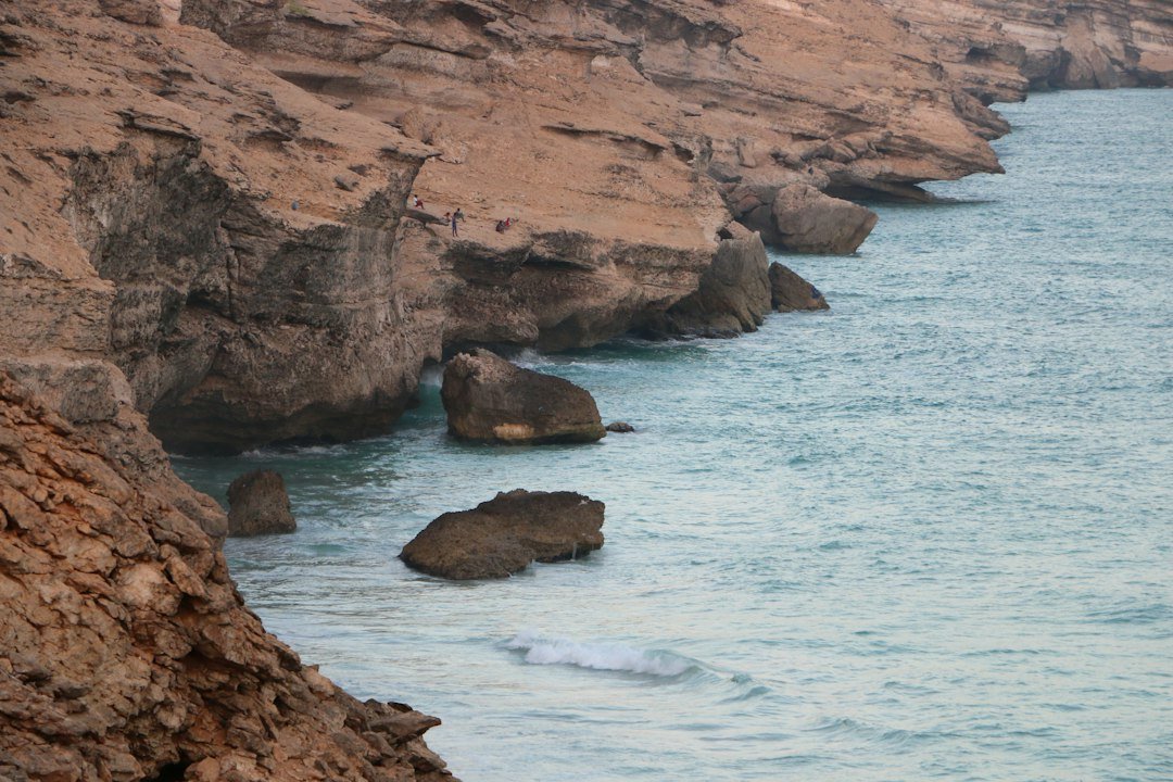 Rugged, remote coastal cliffs along the Arabian Sea, representative image for the isolated border terrain near Jiwani and Border Post 250