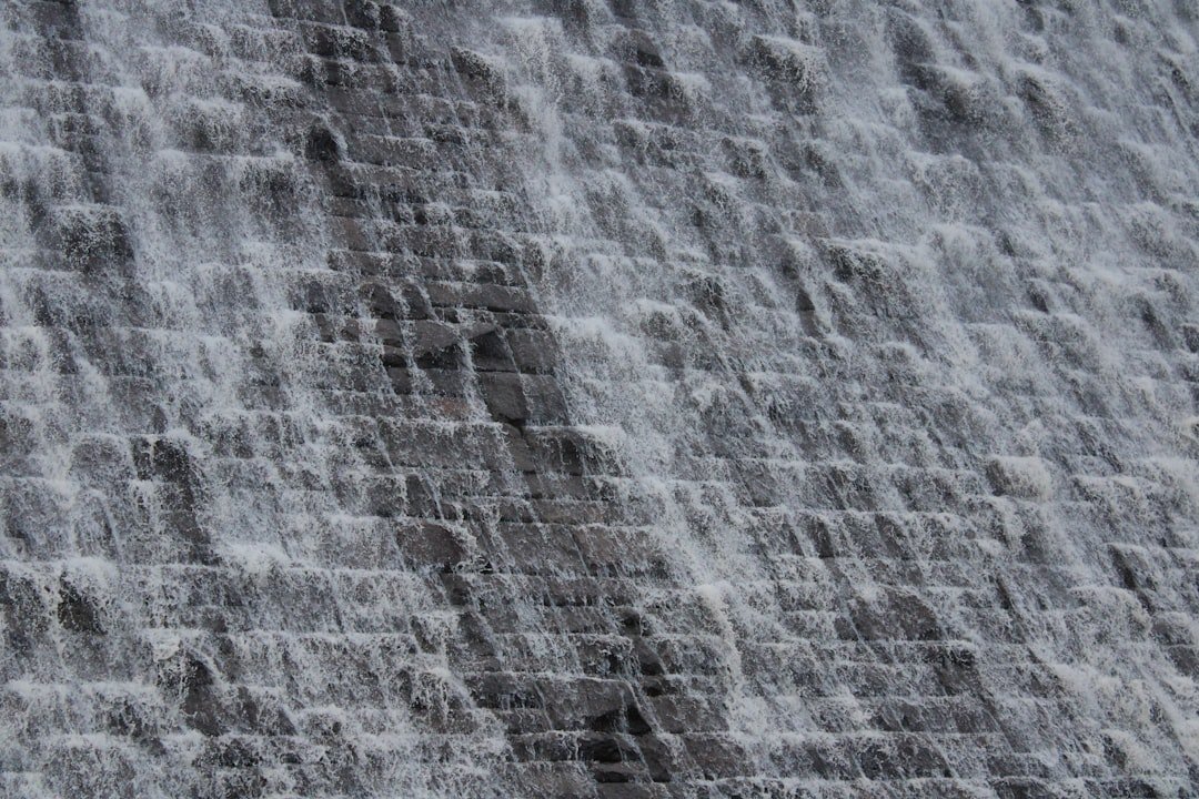 Water cascading down a stone dam face, a representative image of the reservoir infrastructure behind Gwadar's new water supply scheme from Mirani Dam