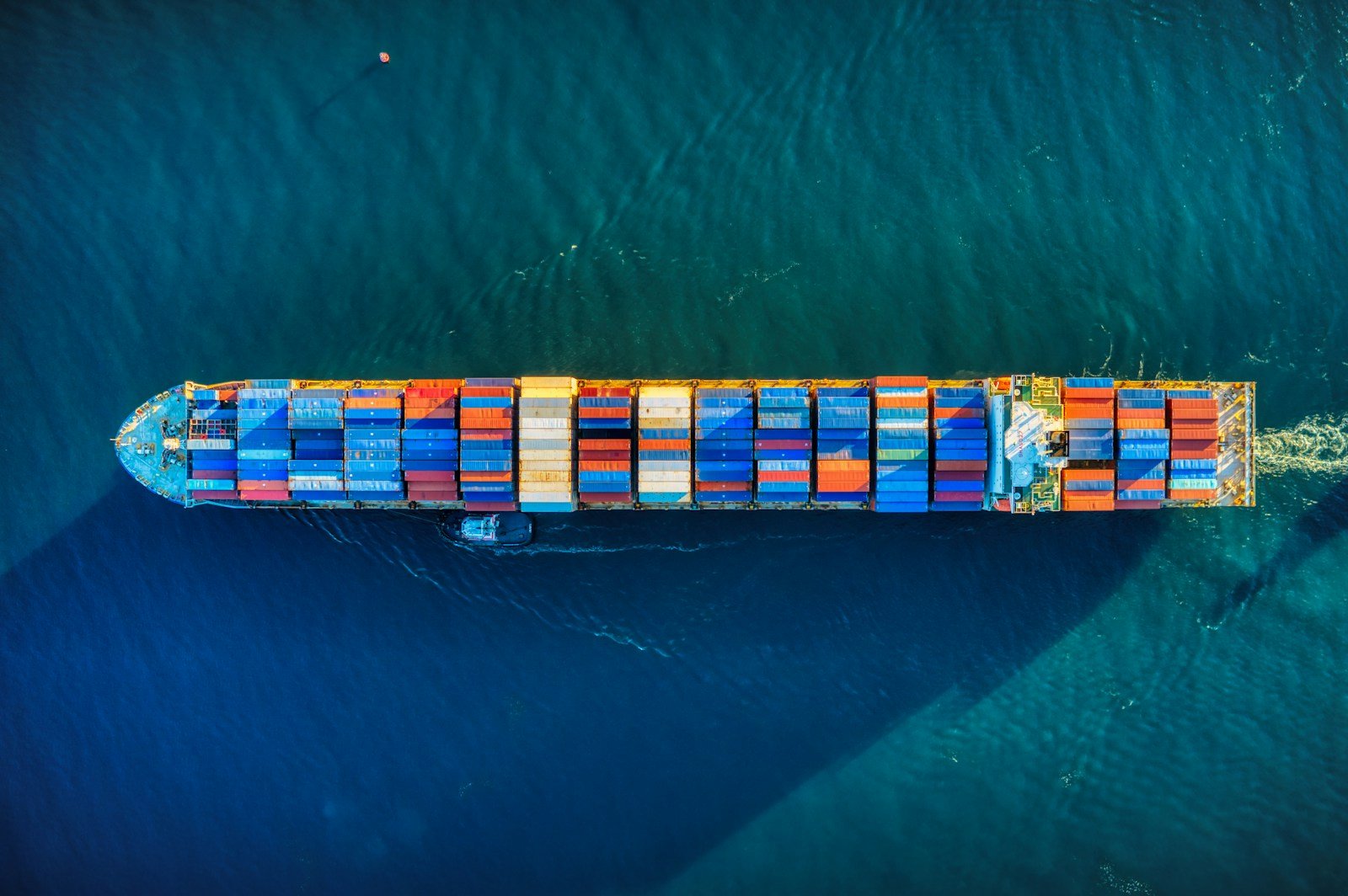 Aerial view of a cargo ship at sea, representative image for the sea shipments carrying frozen donkey meat and hides from Gwadar to China