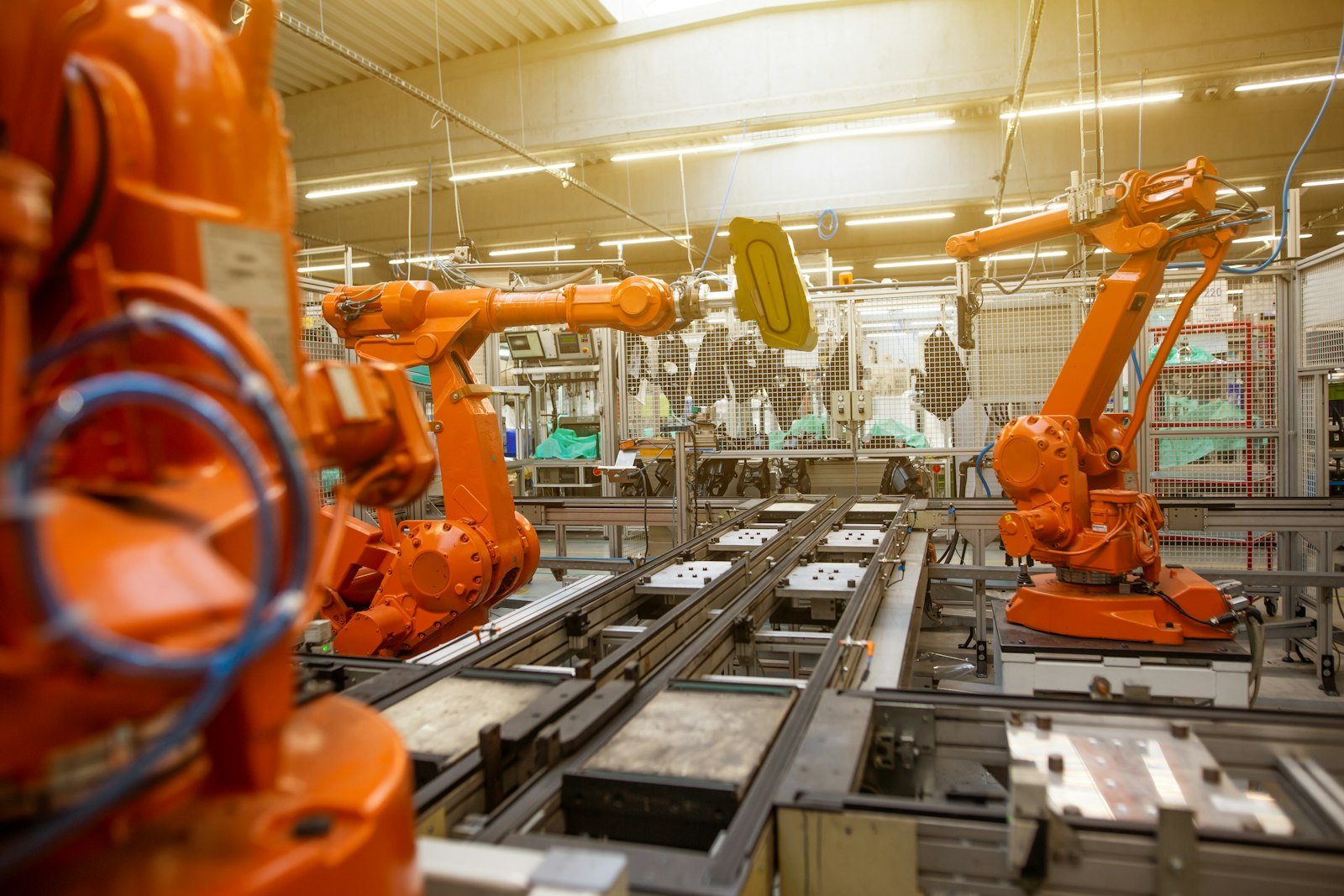 Automated robotic arms on an assembly line inside a modern factory, representative image for the industrial production CPEC 2.0 investment is meant to attract