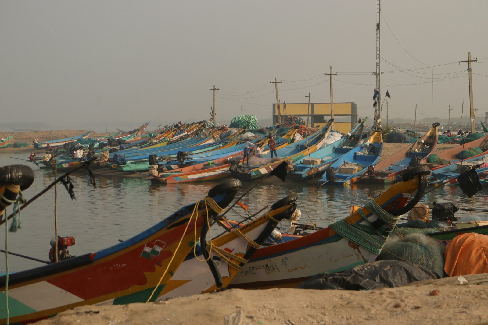 Colorful fishing boats docked in a harbor, representing the Balochistan coastal fishing communities the new Fisheries and Aquaculture Bill aims to protect