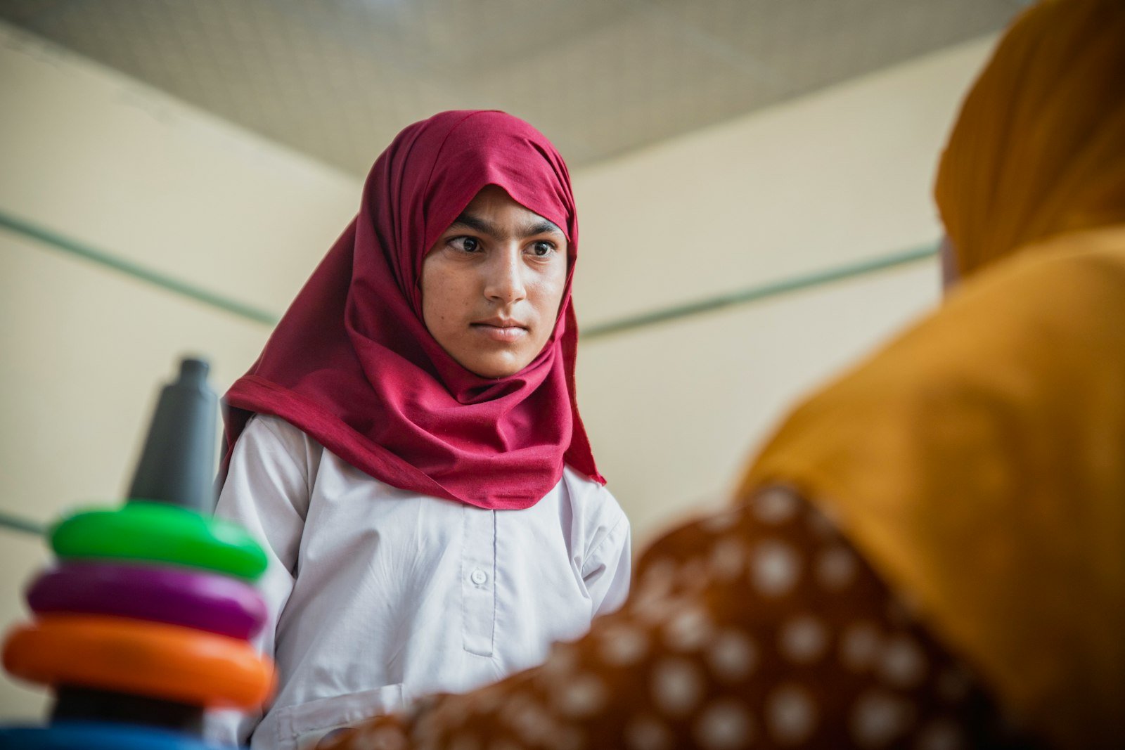 A young student in a classroom, representative image for the school facilities and learning conditions raised at Gwadar's public open court