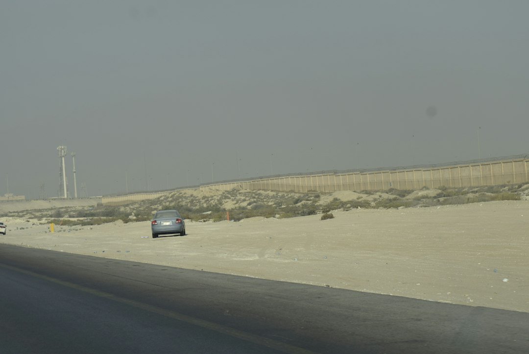 A desert highway with a road barrier, representative image for the Gabd-Rimdan border crossing between Balochistan and Iran