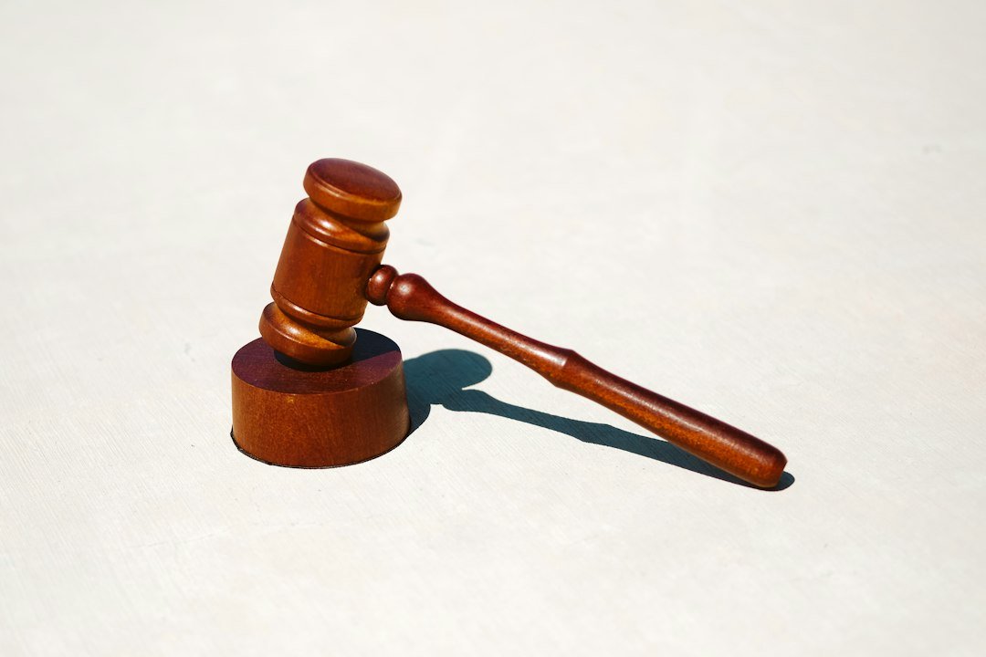A wooden gavel on a table, representative image for the legal settlement process facing parties in Gwadar's New Town land disputes