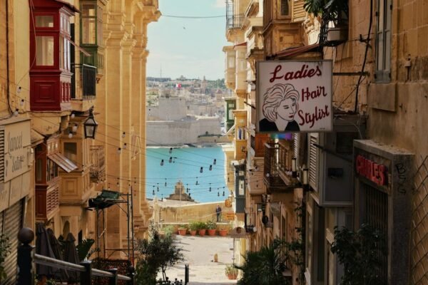 A narrow historic street with balconies leading toward the coastline, representative image for Gwadar's Old Town heritage rehabilitation project