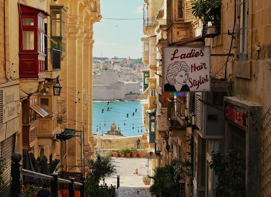 A narrow historic street with balconies leading toward the coastline, representative image for Gwadar's Old Town heritage rehabilitation project