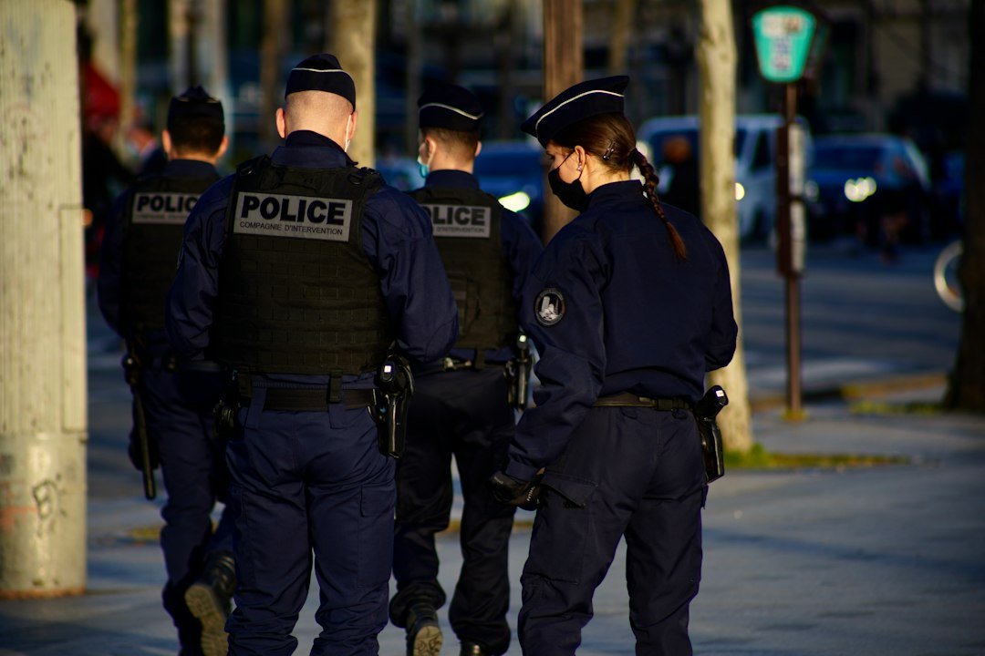 Two police officers in uniform standing on a road, representative image for Gwadar police constables going through a merit-based promotion process