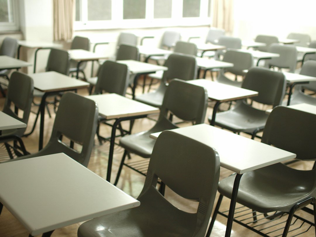 Rows of empty desks and chairs in a hall, representative image for the departmental written examination held for Gwadar police constables