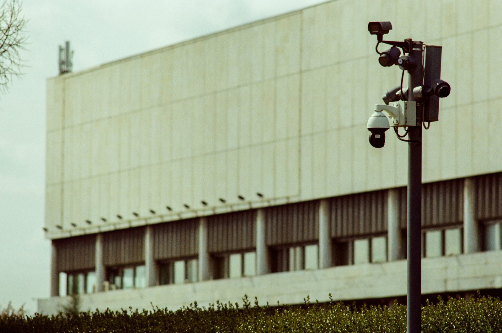 A multi-camera surveillance pole stands in front of a building, representative image for Gwadar's Safe City camera network