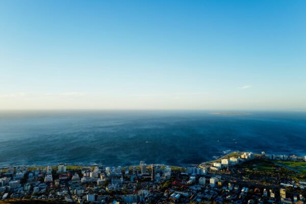 Aerial view of a coastal city meeting the ocean, representative image for Gwadar's Smart Port City Master Plan
