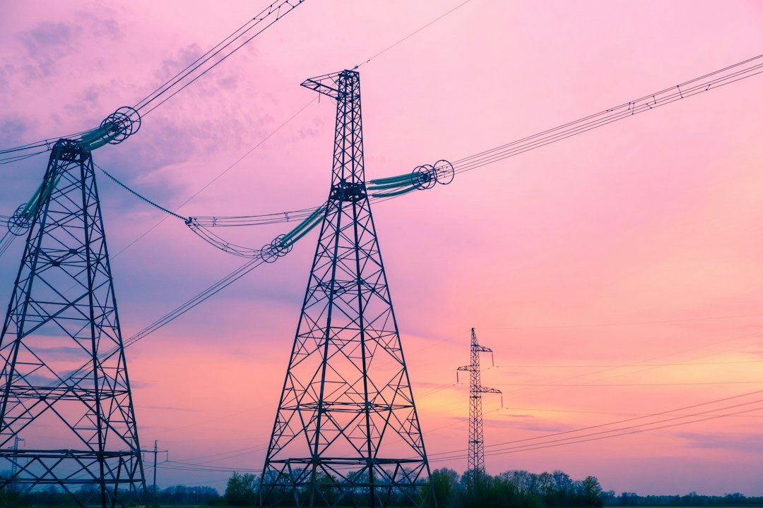 High-voltage transmission tower against the sky, representative image for electricity line losses on the long route to Gwadar