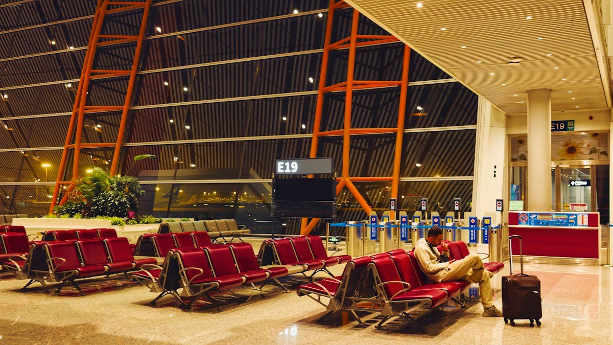 A quiet, mostly empty airport departure lounge with rows of seating, representative of the light passenger traffic at Gwadar's new airport given its limited flight schedule