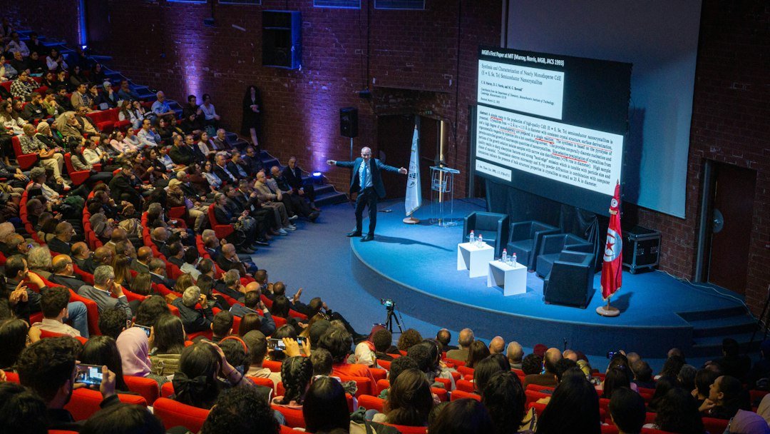 A speaker presenting to a large audience in an auditorium, representative image for the China-South Asia Forum on Poverty Reduction and Development Cooperation held in Islamabad