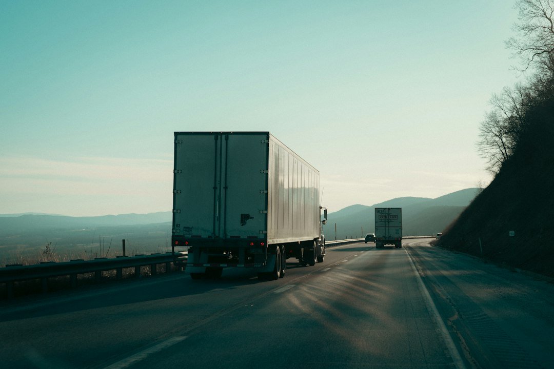 Trucks travelling on a highway through mountainous terrain, representative image for commercial vehicle movement on the Gabd-Rimdan transit corridor between Gwadar and Iran